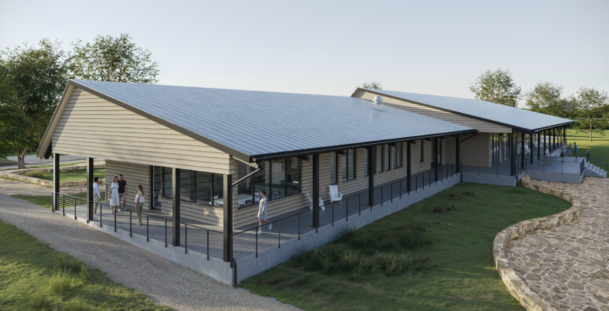 Rendering of outside the future Lake Ralph Hall Visitor Center, showing a covered deck area.